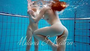 Milana and Katrin strip eachother underwater